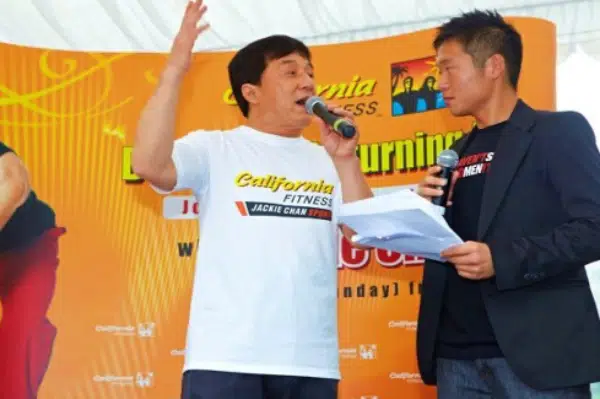 James Yang on stage with Jackie Chan