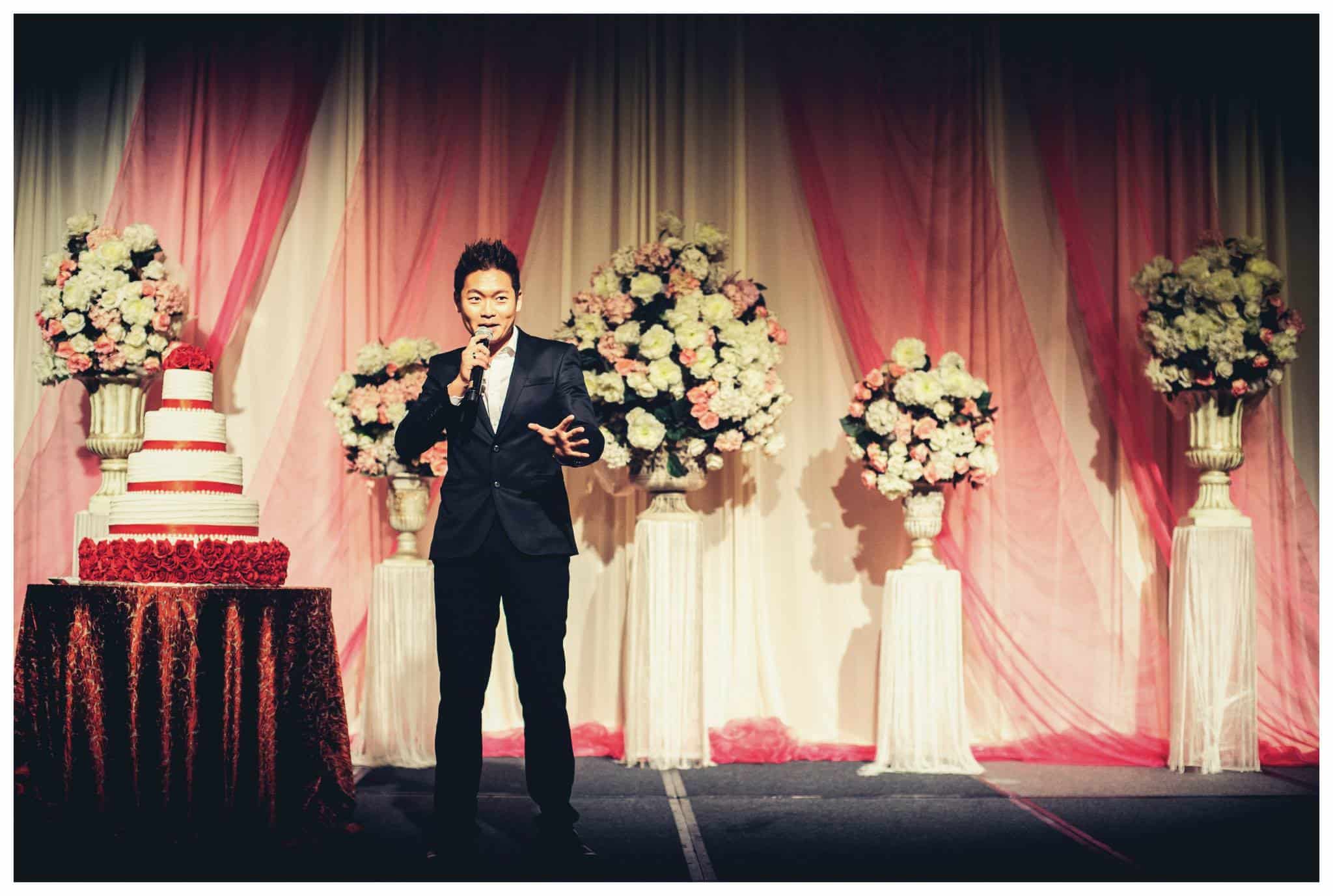 James Yang hosting a wedding banquet on stage